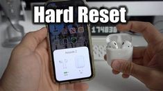 two hands holding an iphone with ear buds in it and the words hard reset above them