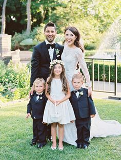 a couple and their children posing for a photo