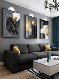 a living room with gray couches and paintings on the wall