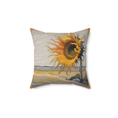 a decorative pillow with a sunflower painted on it