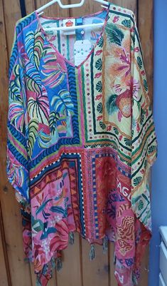 Brand new from FARM for Anthropologie and it's a One Size affair with too much gorgeousness to describe. Amazing combo of colors to delight! 100% rayon. So versatile and WILD! ARTWEAR-- Welcome to Rio V-neck Beach Top With Abstract Print, Multicolor Boho Print Tunic Top, Casual Multicolor Boho Print Cover-up, Bohemian Colorful Pattern Tops For Vacation, Colorful Bohemian Tops For Vacation, Bohemian Colorful Patterned Tops For Vacation, Bohemian Multicolor Print Tops For The Beach, Bohemian Multicolor Print Tops For Beach, Bohemian Tops With Colorful Pattern For Beach