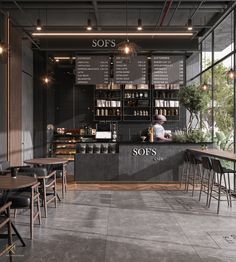 the interior of a restaurant with tables, chairs and menus on the wall behind it