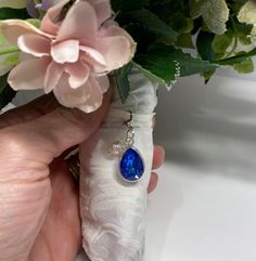 "This is a modern take on the traditional \"something blue\" to represent purity, love, and fidelity. A luxuriously sparkly, royal blue pear-shaped Swarovski crystal is featured in a rhodium-plated setting and hung from a silver-finished clasp. Perfect for any bride to wear on her wedding gown, in her bridal bouquet, or even on her wedding garter! Make this charm extra special by adding a beautiful, genuine cultured pearl--simply select that option when adding the charm to your cart. After the w Something Blue Wedding Ideas, Something Blue Ideas, Wedding Charm, Bouquet Charms, Something Blue Wedding, Blue Charm, Wedding Garter, Outside Wedding, Kids Necklace