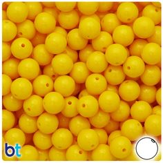 yellow plastic beads with holes in the middle