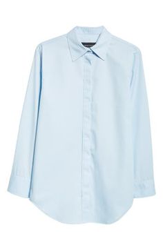 This button-up is cut with a split back yoke, creating a fuller, more modern fit to go with the entrancing exit view in this style. 30" length (size 4) Hidden-button placket; back one-button closure Spread collar Long sleeves with button cuffs Curved hem 100% cotton Dry clean Made in the USA Designer Clothing Classic Blue Blouse With Shirttail Hem, Modern Blue Blouse For Office, Chic Spring Workwear Dress Shirt, Modern Blue Button-up Blouse, Chic Dress Shirt With Spread Collar For Spring, Elegant Blue Blouse With Shirttail Hem, Elegant Blue Tops With Shirttail Hem, Blue Shirt With Back Button Closure For Work, Brandon Maxwell