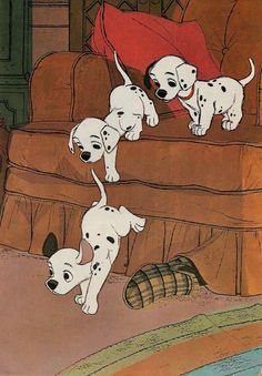 the three puppies are playing with each other in front of a couch and a barrel