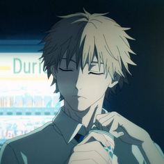 an anime character with short hair holding a cell phone in his hand and looking at the camera