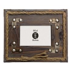 an old wooden frame with rope around it and a logo on the front that says,