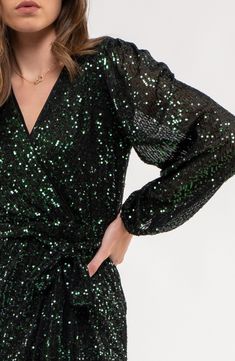 A waist-accentuating tie adds extra style points to a long-sleeve dress covered in shining sequins. 47" length (size Small) Surplice V-neck Long sleeves Removable waist tie
 Lined 95% polyester, 5% spandex Hand wash, dry flat Imported Model stats: 5'10" height, 32" bust, 25" waist, 36" hip. Model is wearing size Small. Dress Cover, Sequin Long Sleeve Dress, Sheer Sleeves, Ringing In The New Year, Waist Tie, Long Sleeve Sequin Dress, Puff Sleeves, Wrap Midi Dress, Formal Event