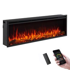 an electric fireplace with remote control and fire flames on the wall, in front of a white background