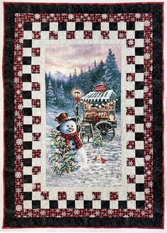 a quilted christmas scene with a snowman in front of a cart filled with gifts