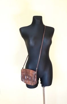 "Vtg leather and vegan leather (mixed materials) cognac brown patches 80s bag. Shoulder bag, crossbody purse. Patched adventure flap bag. The interior not lined, but inside are textile as leather bottom base. With 2 compartments and 1 zippered compartment inside. condition: Good vintage condition. No damages. The closure and zippers works well. Measures: Width 19 cm/ 7.4\" in Height 17,5 cm/ 6.8\" in strap length 119 cm / 46.4\" in" Vintage Brown Crossbody Flap Bag, Brown Leather-backed Crossbody Flap Bag, Brown Leather Backed Crossbody Flap Bag, Brown Leather Backing Crossbody Flap Bag, Italian Bags, Brown Leather Crossbody Bag, Women Purse, Brown Handbag, Patchwork Bags