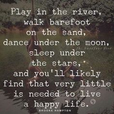 two people sitting on the edge of a body of water with a quote about playing in the river, walk barefoot on the sand, dance under the moon, sleep under the stars and you'll