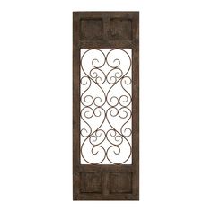 an old wooden door with wrought iron design