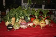 there are many vegetables with faces painted on them