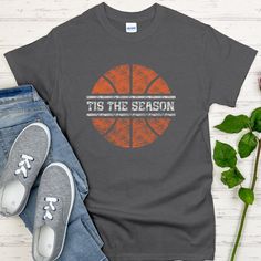 🚨 For Christmas 2024, order deadline is Monday, December 9 for delivery by Christmas. If an order is place after Monday, December 9, it may not arrive by Christmas. We will continue processing orders.🚨 Basketball season is nearly upon us. Support your favorite basketball player or team with this Tis the Season shirt.  The unisex heavy cotton tee is the basic staple of any wardrobe. It is the foundation upon which casual fashion grows. All it needs is a personalized design to elevate things to Basketball Fan Apparel Cotton T-shirt, Graphic Cotton Basketball T-shirt, Cotton Graphic Tee For Basketball, Graphic Cotton T-shirt For Basketball, Cotton Crew Neck T-shirt For Basketball, Cotton Short Sleeve T-shirt For Basketball, Basketball Cotton Tops With Screen Print, Basketball Team Name Cotton T-shirt, Basketball Team Name T-shirt In Cotton