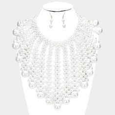 Pearl Bubble White Collar Statement Necklace SetItem: Necklace & Pierced EarringsBrand: Sparkle ARMANDColor: White, SilverLength: 18" + 3" Long (inches) Decor Size: 7.5" (inches)Earrings: 1.75" Long Fastening: Lobster Clasp Metal: Alloy, Lead & Nickle FreeMaterials: Metal, Faux Pearls Theme: Statement, Couture, Evening All Measurements are Approximate Sold As One Individual Necklace and One Matching Pair Of Pierced Earrings