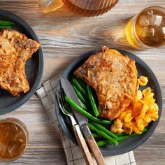 two plates with meat, green beans and macaroni