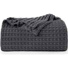 an image of a blanket that is made out of dark gray fabric with small squares on it