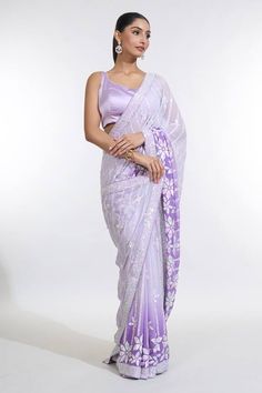 Grey and purple ombre saree with all over sequin bloom embellishments. Paired with a sleeveless round neck satin blouse. - Aza Fashions Purple Tissue Silk Pre-draped Saree For Reception, Glamorous Organza Pre-draped Saree, Glamorous Tissue Silk Pre-draped Saree, Bollywood Style Purple Pre-draped Saree With Sequins, Purple Bollywood Style Pre-draped Saree With Sequins, Purple Bollywood Pre-draped Saree With Sequins, Purple Sequined Bollywood Pre-draped Saree, Glamorous Organza Blouse Piece, Lavender Saree With Zari Work For Party