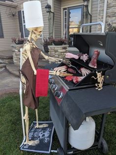 a skeleton grilling food on top of a bbq in front of a house