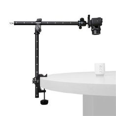 a tripod mounted on top of a white table