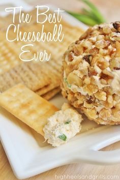 the best cheeseball ever on a plate with crackers