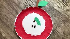 a paper plate with an apple on it