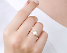 * Stunning handmade solid gold pearl ring. Adorned with tiny beads of white zircon gemstone to emphasize the unique design. This ring is designed to look elegant from all sides of your finger. You will not be able to take your eyes off the fascinating color of opal stone and the magnificent glitter of solid gold. 14K and 18K options are avaliable. It is suitable for daily use * ★Item Details ♥Made to Order ♥Gold Kt: 14K & 18K ♥Available Gold Color: Gold, Rose Gold, White Gold ♥Pearl Stone Si Pearl Ring With Diamond Accents, Fine Jewelry Pearl Ring In Diamond White, Fine Jewelry Diamond White Pearl Rings, Delicate Pearl Ring With Diamond, Fine Jewelry Pearl Ring With Diamonds In Rose Gold, White Pearl And Diamond Open Ring, Pearl Rings With Diamond Accents For Gift, Delicate Yellow Gold Pearl Ring With Diamonds, Delicate Yellow Gold Pearl Ring