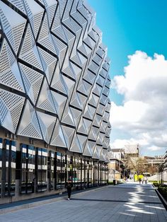 the building is made up of many different types of metal sheets and has geometric designs on it