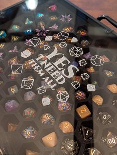 the back side of a glass case with dice and numbers on it that says, hey need