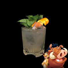 the lion king cocktail is ready to be served with an orange slice and mint garnish