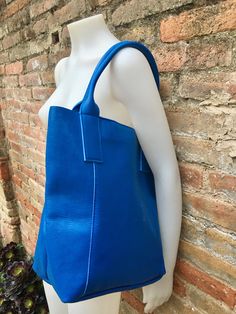 Large tote leather bag in COBALT BLUE. Shopper bag. Blue color natural GENUINE leather. Large enough for books or a laptop, tablet, cosmetics bag etc. Blue leather shopper. Carry all strong leather bag. Cobalt blue laptop or book bag. The inside of the bag is not lined (although properly finished!) . We added a small leather pouch attached by a chain. Zipper at the top. Excellent quality soft but strong genuine leather. Width upper part: 41cm - 16 inch Height: 35 cm - 14 inch Base: 16 cm x 23 cm Small Leather Pouch, Tote Leather Bag, Blue Laptop, Leather Shopper Bag, Suede Tote Bag, Slouch Bags, Tablet Bag, Small Coin Purse, Cosmetics Bag