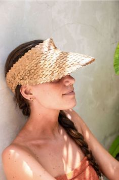 Our sun visors have been intricately woven by hand using palm leaves. They're stylish, compact for travel, help protect your face from the sun, and feature a comfortable cotton-lined elastic stretch band in the back. They're the perfect sunny day accessory, and available in neutral colors to compliment every outfit. Specifications: materials: palm leaf, cotton, nylon for stretch band approx. hat dimensions 10" x 9"; brim length at center: 4"-5" elastic band is one size fits most available in honey brown, vanilla cream, black coffee due to the handmade nature of this item, slight variations may occur Honey Brown, Stretch Band, Stretch Bands, Vanilla Cream, Sun Visor, Palm Leaf, Summer Accessories, Palm Leaves, Black Coffee