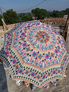 an umbrella is sitting on the ground outside