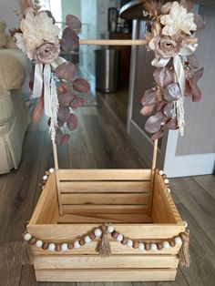 a wooden box with flowers and pearls on it