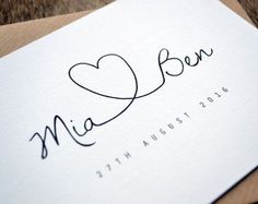 a close up of a piece of paper with the word love written in cursive writing