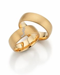 two yellow gold wedding bands with diamonds