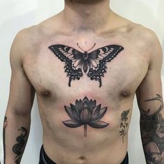 a man's chest with a butterfly and lotus tattoo on it