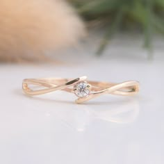 a gold ring with a diamond on it