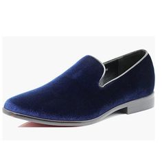 a blue slip on shoe with white soles