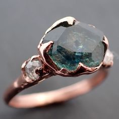 Partially faceted blue green Montana Sapphire and fancy Diamonds 14k R – by Angeline Green Montana, Engagement Wedding Ring, Montana Sapphire, Wax Casting, Fancy Diamonds, Rose Gold Engagement, Minerals And Gemstones, Sapphire Stone, Lost Wax