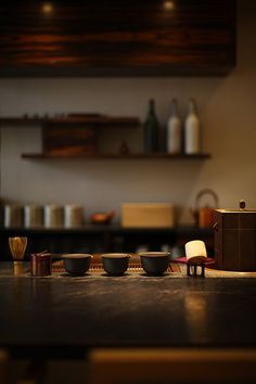 bowls and utensils are sitting on the counter