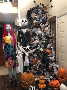 a decorated halloween tree with pumpkins and jack - o'- lanterns