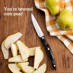 there is a knife next to some cut apples on a cutting board with the words, you're beyond com - pear