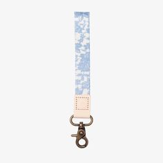 a blue and white strap with a metal hook