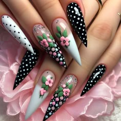 "Stunning pointed long nails with black and white polka dots, accented by tiny pink and green flowers for a beautifully crafted look." Nails With Black And White, Uñas Coquette, Flower Pattern Nails, Fingernail Ideas, Pattern Nails, Nails With Black, Pink And Green Flowers, Pop Art Nails, Polka Dot Nail Art