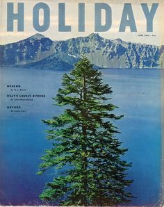 a magazine cover with a pine tree in the foreground and mountains in the background