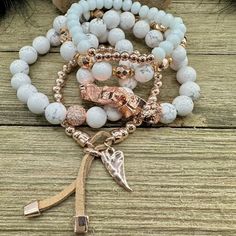 Boho Blush Bracelet Stack – where the enchanting hues of rose gold and pristine white hues come together in a whimsical dance of elegance and boho charm. This stack isn't just jewelry; it's a serenade to your free-spirited soul. Treat yourself with the Boho Blush Stack and let each bracelet tell a tale of carefree grace. So Pretty!! Wear them all on one wrist and stack 'em up or wear 3 on one wrist and two on the other with a watch! Lead & Nickel Free Bracelets are 'one size fits most' and are designed to fit wrists up to 7.5" comfortably Stretch bracelets set of 5 Off White and Rose Gold Hues Pave Crystal Embellishment Heart Charm with Leather Fringe Pull Please be aware that due to the unique and handmade nature of each product, colors, shapes, and bead sizes may vary slightly from the p Rose Gold Bohemian Bracelets, Bohemian White Bangle Jewelry, Spiritual Rose Gold Beaded Jewelry, White Bohemian Charm Bracelet For Gift, Bohemian White Charm Bracelet For Gift, Bohemian Rose Gold Beaded Bracelets Gift, Bohemian Style White Charm Bracelet For Gift, Rose Gold Beaded Bracelet Jewelry, Rose Gold Bohemian Bracelet As Gift