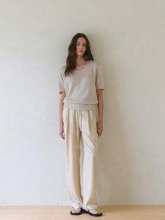 This is a minimal and modern pants by dankedir that is made out of high quality and sturdy material. With distinctive mood of the design and comfortable wear, you can style it for your clean daily outfit.- Semi wide silhouette- Subtle gloss of light fabric- Adjustable strap on the waist- Trendy and feminine mood Modern Trousers For Loungewear, Casual Loungewear Pants With Minimal Stretch, Stretch Viscose Pants For Loungewear, Straight Pants With Elastic Waistband Minimal Stretch, Viscose Ankle-length Lounge Pants, Viscose Ankle-length Loungewear Pants, Ankle-length Viscose Pants For Loungewear, Beige Tapered Leg Bottoms For Daywear, Beige Wide Leg Pants For Daywear